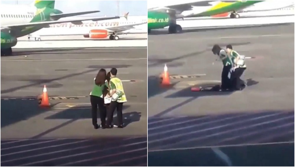 A woman is restrained on the tarmac at Bali’s Ngurah Rai International Airport as she tries to catch up with her flight. Photos via footage shared by Denpasar Viral