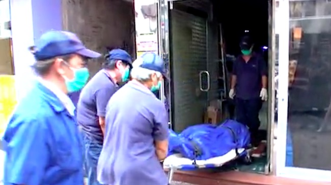 A man who had been working two restaurant jobs was found dead inside a 24-hour internet cafe he was sleeping rough in. Screengrab via Apple Daily video.