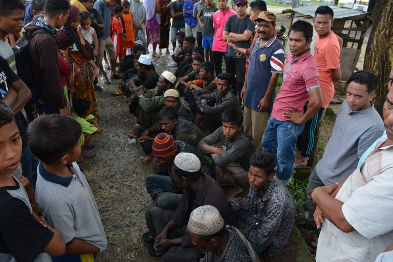 Suspected Rohingya people arrive in Idi Rayeuk, East Aceh on December 4, 2018. – About 20 men believed to be Rohingya landed in Indonesia, authorities said, the latest batch of the vulnerable minority to come ashore in the world’s biggest Muslim majority nation. (Photo by CEK MAD / AFP)