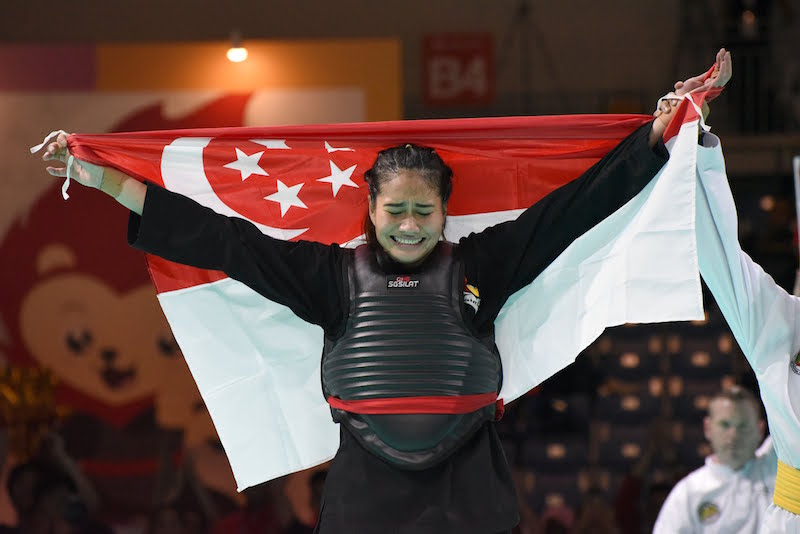 Singapore’s Nurul Suhaila Mohd Saiful claimed her first world title after having defeated her opponent Janejira Wankrue from Thailand in Class D (60-65kg) with a score of 5-0. Photo: Singapore Silat Federation