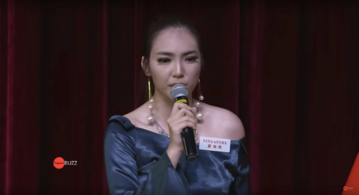 Miss Singapore World Vanessa Peh speaks at a head-to-head challenge against Miss Nepal at the Miss World 2018 qualifiers (Photo: Screenshot from PageantBuzz/YouTube)