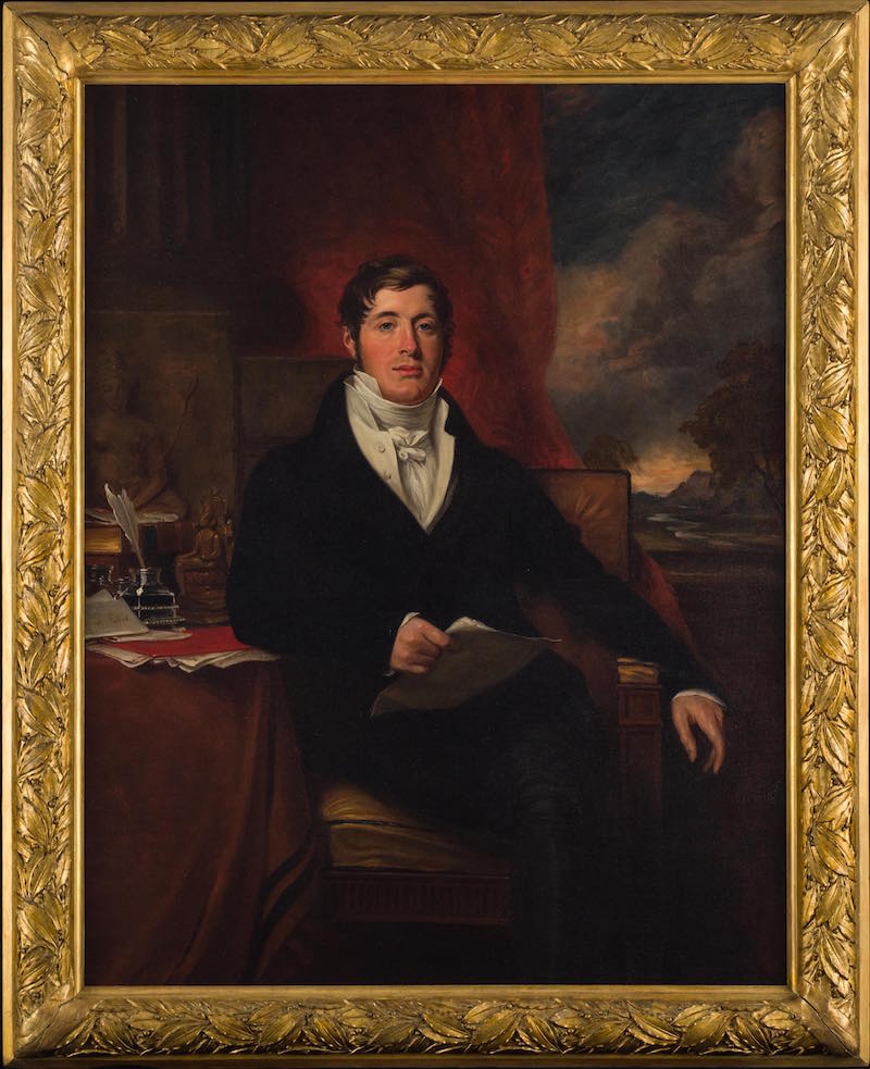 Portrait of Sit Thomas Stamford Bingley Raffles, copy of the original by George Francis Joseph in the National Portrait Gallery, London. Raffles sat for the portrait in 1817 during his return to England at the end of his governorship of Java. He portrayed himself in the style of the 'scholar-gentleman' and administrator, complete with papers in hand, Buddhist artefacts, and a romanticized landscape of Java in the backdrop. Photo: National Museum of Singapore