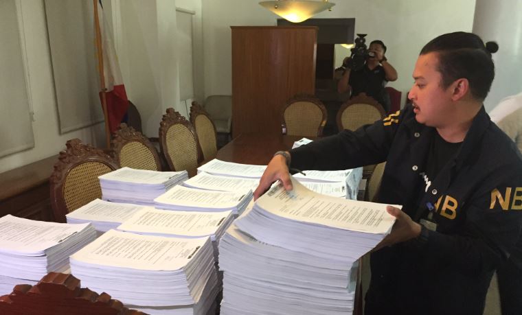 A member of the National Bureau of Investigation brings the documents needed for their case against former Bureau of Customs chief Isidro Lapeña today at the office of the Department of Justice. Photo: Mike Navallo/ABS-CBN News