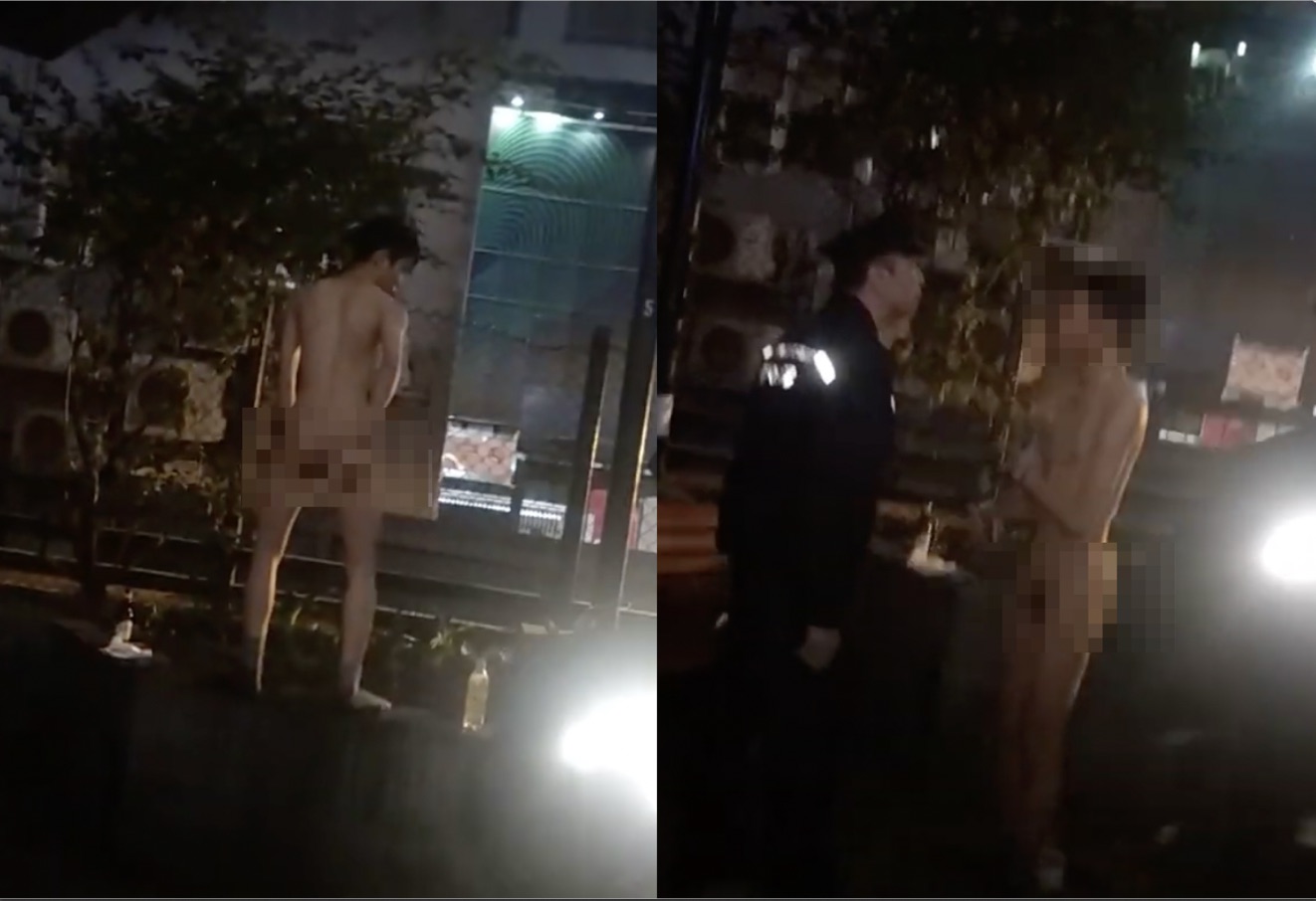 An 18-year-old man was arrested for stripping down naked to his socks and shaking his behind in front of entertained and scandalized Lan Kwai Fong revellers. Screengrab via YouTube.