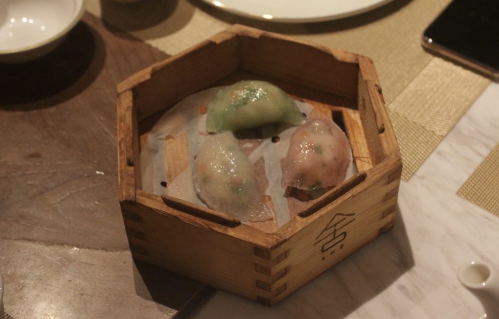SHÉ's tricolour steamed dumplings with prawn, vegetables and pine nuts. Photo by Vicky Wong.