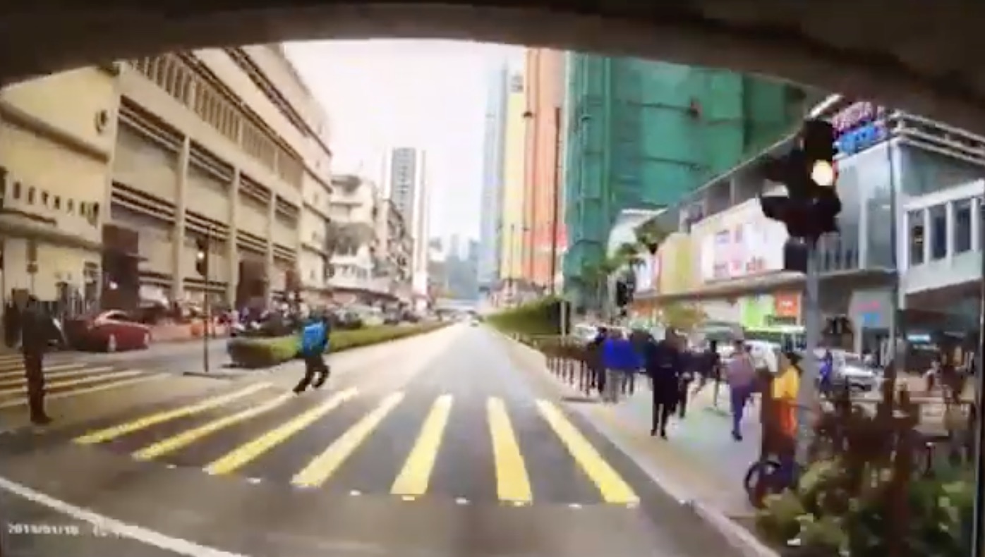 Dash cam footage has been circulating online showing the moment a school but hit a man crossing the road in Tsuen Wan. Screengrab via YouTube.