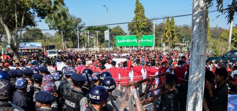 Police block protesters as they gather near a statue of General Aung San during a demonstration in Loikaw on February 12, 2019. Police fired rubber bullets into a crowd of several thousand demonstrators in eastern Myanmar on February 12, activists said, as protests mount over a new and controversial statue. The bronze structure depicts the father of de facto civilian leader Aung San Suu Kyi — Aung San — on horseback and was unveiled early this month in the capital of Kayah state despite strong opposition. AFP.