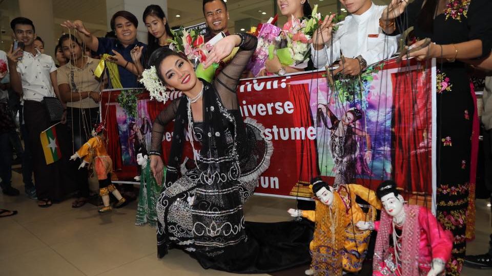 Miss Universe Myanmar 2016, posing with Burmese puppets via Htet Htet Tun Facebook Page, February 2017. 