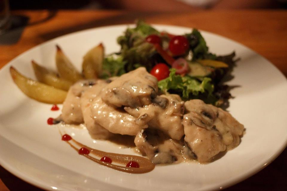 Chicken Breast Scallopini seared in braised in rich creamy mushroom sauce served with roasted potatoes and mixed Garden Salad | Nay Paing