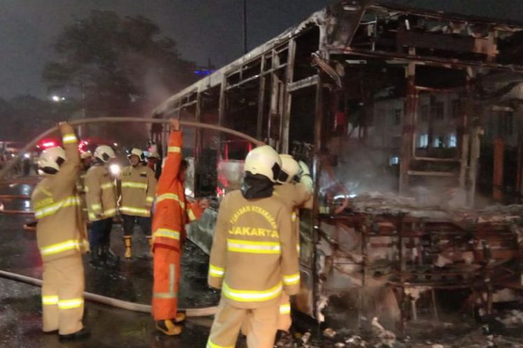 Firefighters putting out fire in a TransJakarta bus in Central Jakarta on Feb 18, 2019. Photo: Central Jakarta Fire Department