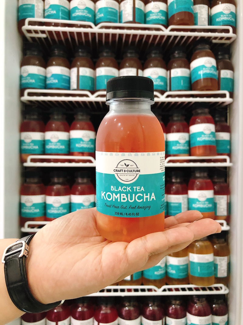 Rows and rows of kombucha in the shop space. Photo: Coconuts Media