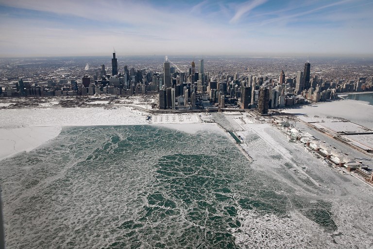 Ice builds up along the shore of Lake Michigan in Chicago as temperatures during the past two days have dipped to lows around -28 degrees Celsius. Photo via AFP.