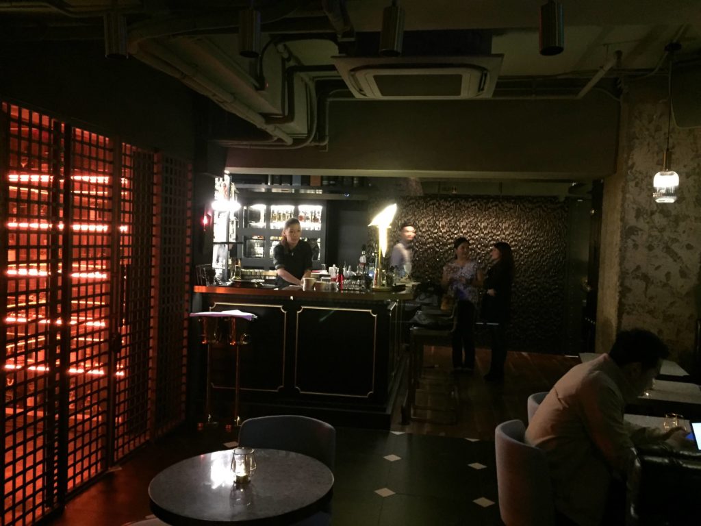 A view of ThirtySix's dimly lit interior, with the bar's whiskey 'vault' on the left. Photo by Stuart White.