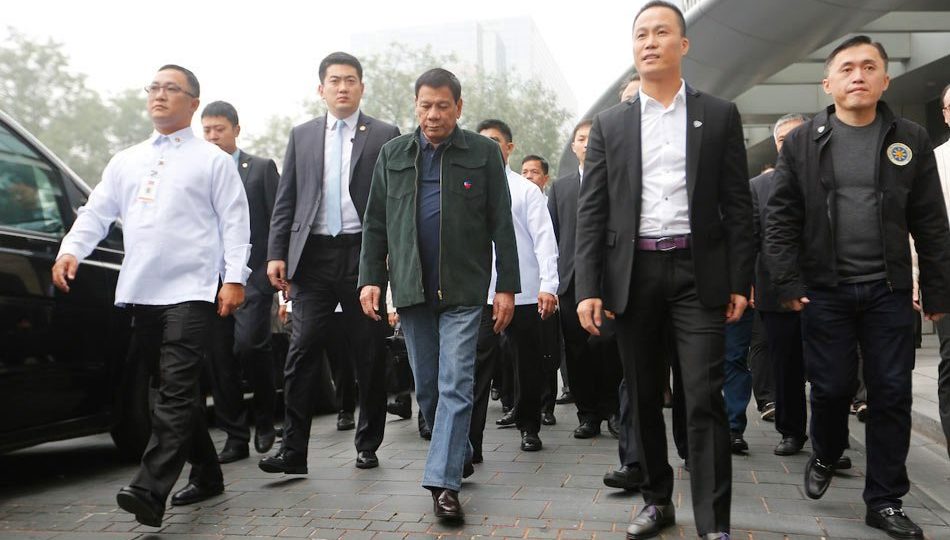 President Rodrigo Duterte with his adviser Michael Yang (right, in white shirt and black jacket). Photo: Toto Lozano/ Malacañang Palace 