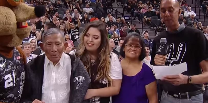 Liban Brillantes with his family at the AT&T Center in San Antonio, Texas. Photo: Screenshot from San Antonio Spurs’ Facebook account