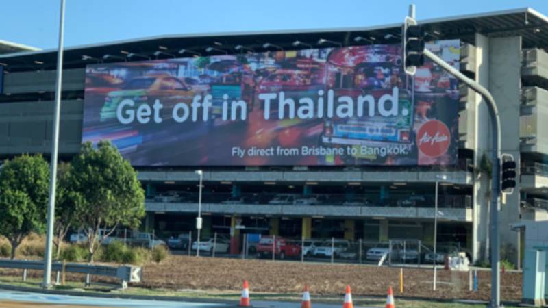 The ad  outside of Brisbane Airport. Photo: Twitter/ Coralie Alison