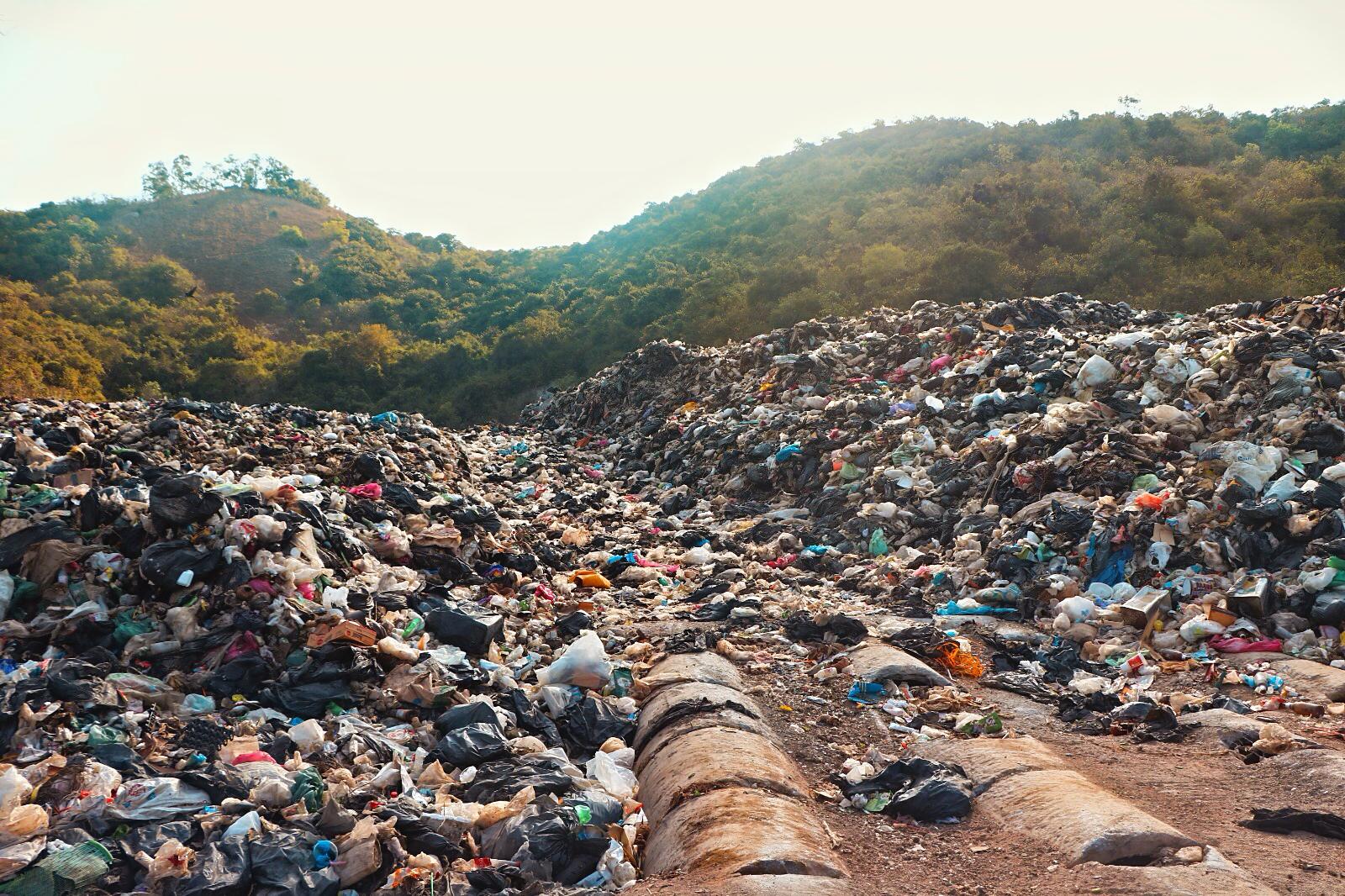 Garbage pile matching the mountain range behind it. Photo: Ajith Srinivasan/ Coconuts Media