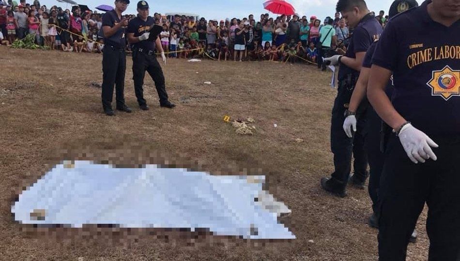 Authorities inspect Christine Silawan’s cadaver in Lapu-Lapu City. Photo: ABS-CBN News