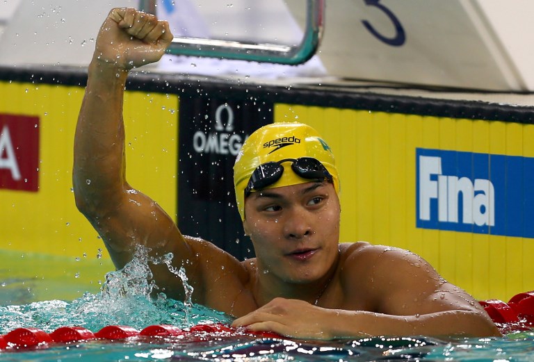 Kenneth To celebrates after winning the men’s 100-meter breaststroke race at the 2013 FINA Swimming World Cup in Dubai. Photo via AFP.