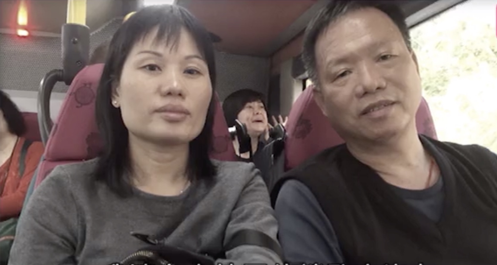 So Kwok-wah (right) with his wife. He was the bus driver who died after his vehicle collided with the back of a truck on a highway. Screengrab via Apple Daily.