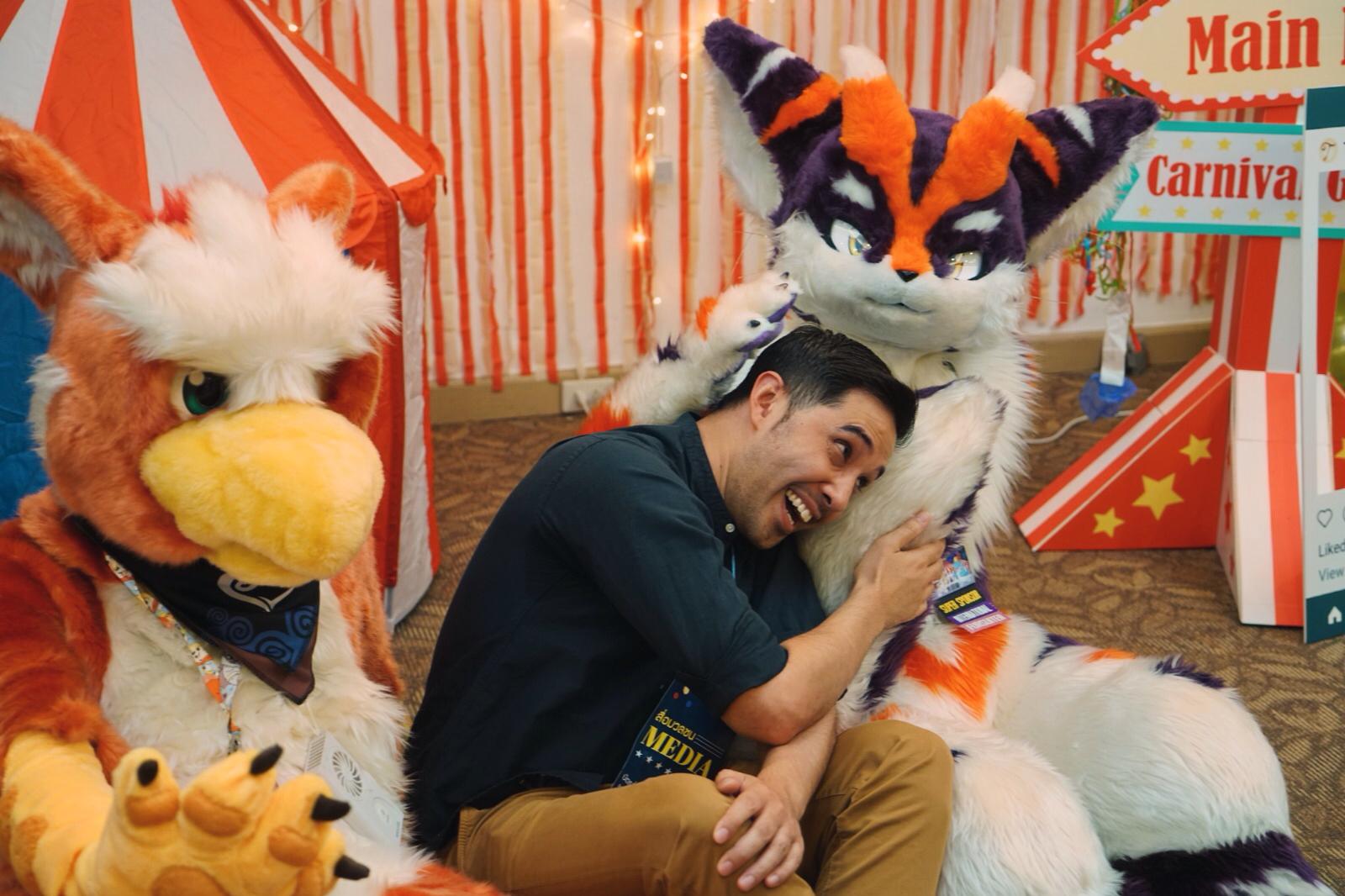 A Coconuts TV video producer getting cosy with a couple of furries