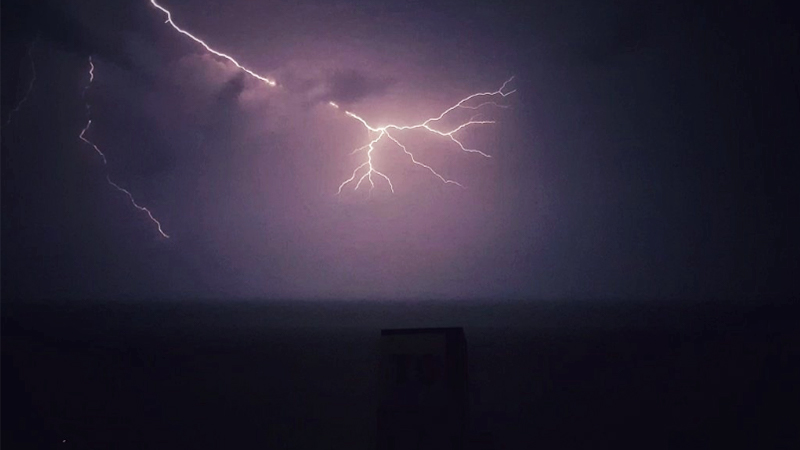 A flash of lighting from last night’s freak storm. Photo: @Romeo_Jokers/ Twitter