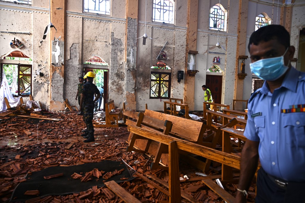 Security personnel inspect the interior of St Sebastian’s Church in Negombo on Monday, a day after the church was hit in a series of bomb blasts targeting churches and luxury hotels in Sri Lanka. Photo via AFP.