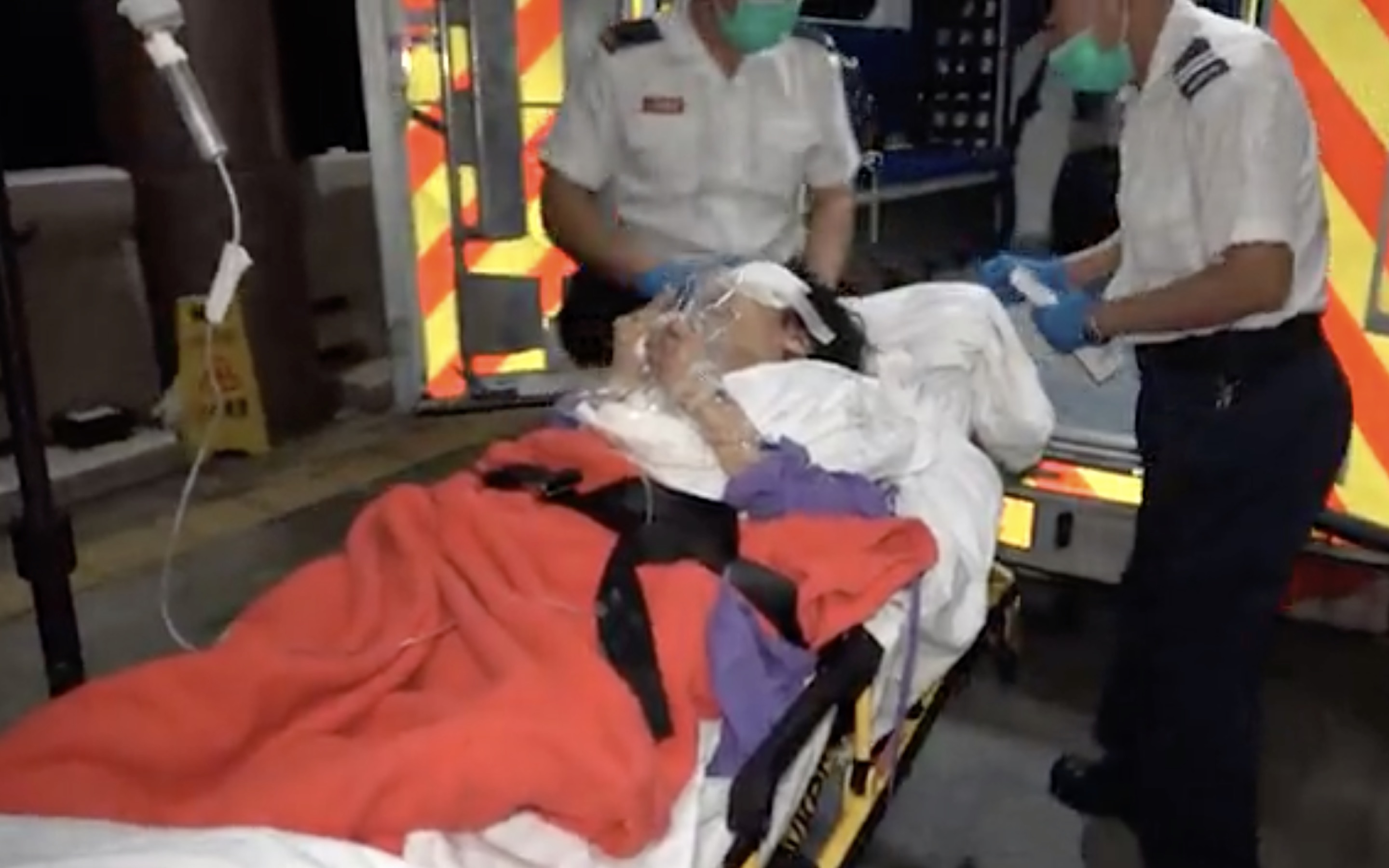 An elderly woman was taken to hospital after having her eye taken out. Screengrab via Apple Daily video.