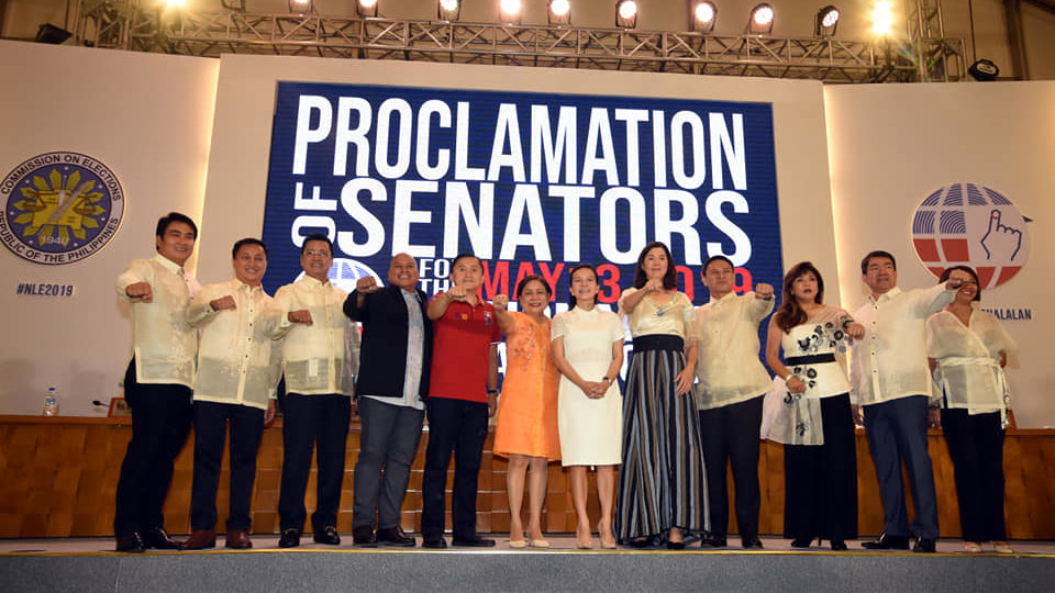 Grace Poe stands in the middle in a white dress, while Nancy Binay stands on the far right. Photo: Cynthia A. Villar/FB