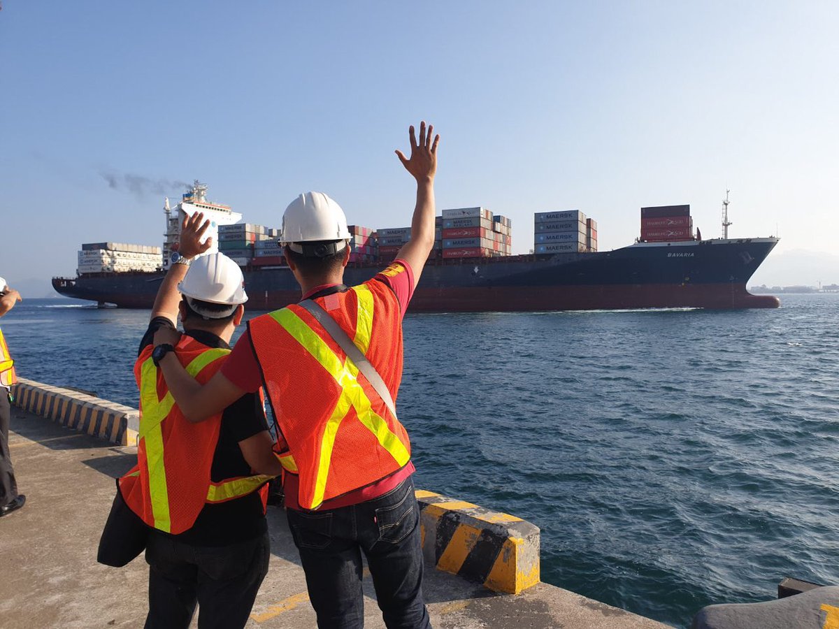 Workers wave goodbye to the MV Bavaria ship carrying the controversial Canadian garbage that had been in the Philippines for six years. Photo: @teddyboylocsin/Twitter