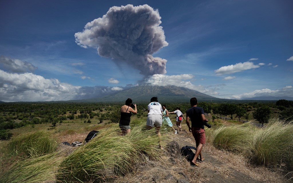 A plume of ash is released as Mount Agung volcano erupts, seen from the Kubu subdistrict in Karangasem Regency on Indonesia’s resort island of Bali on May 31, 2019. Photo: Made Alit Suantara / AFP 