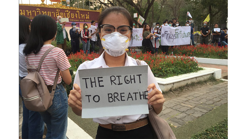 A Chiang Mai University student holds a sign during the March 15 climate strike event. Photo: Greenpeace Thailand / Twitter