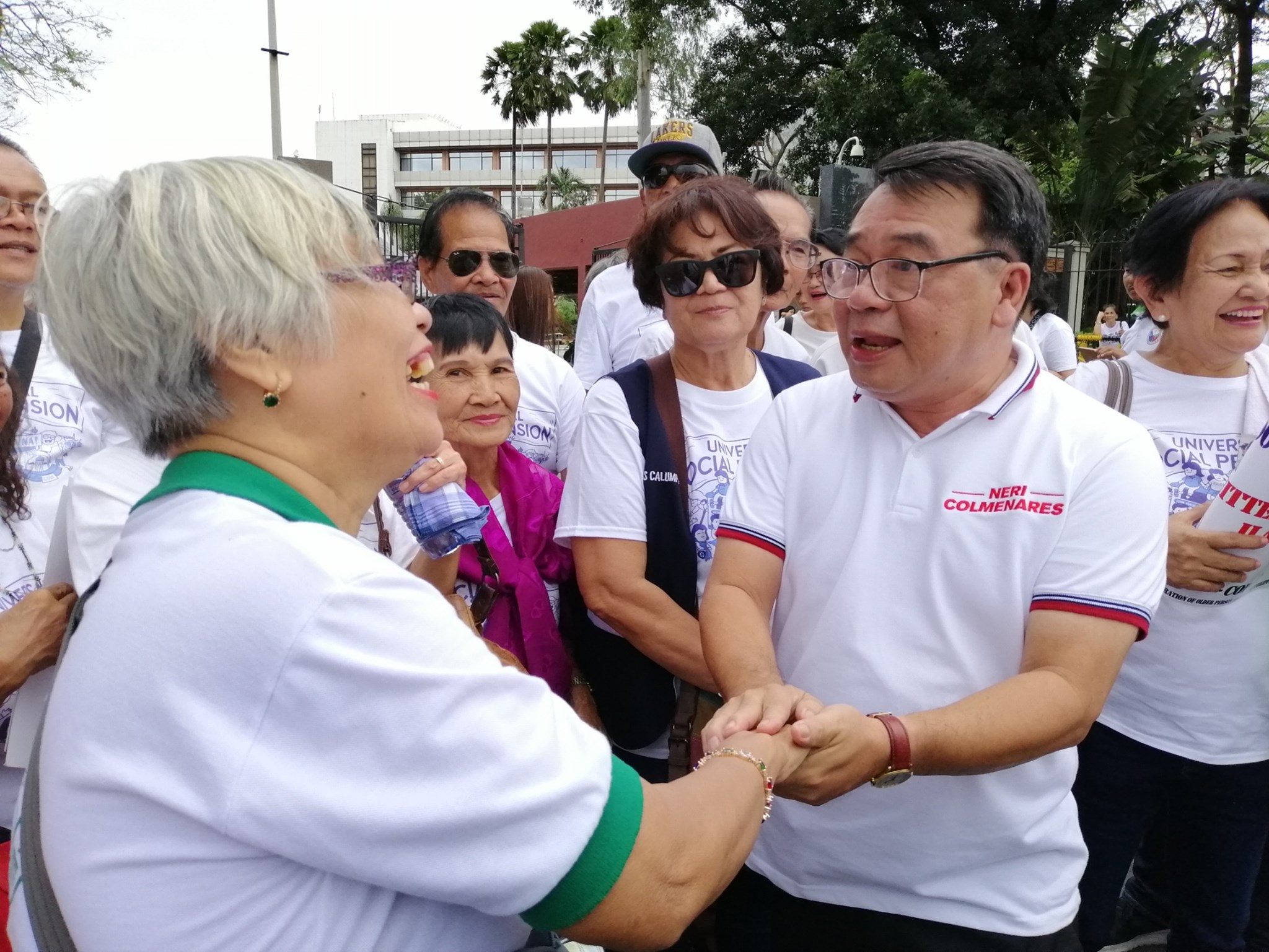 Neri Colmenares (right) shaking the hands of a supporter during the 2018 campaign. Photo: Colmenares’ Facebook page.