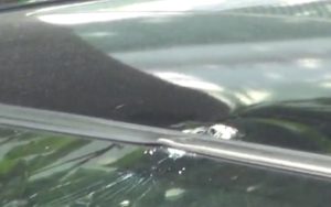 Bullet hold on the roof of the Mercedes Benz. Screengrab via Apple Daily video.