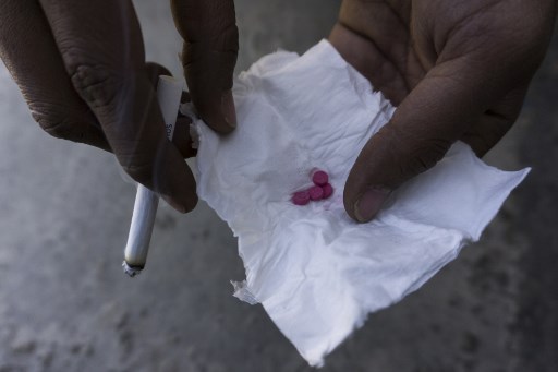 This photo taken on January 11, 2019 shows a drug user user holding low-grade crystal meth tablets, known in Southeast Asia as “yaba”, in Muse, Shan State, along Myanmar’s border with China. – Myanmar is the second-biggest producer of opium in the world after Afghanistan and is now believed to be the largest source of methamphetamine. (Photo by Ye Aung THU / AFP) / TO GO WITH Myanmar-health-drugs-opium-meth-conflict,FEATURE by Hla Hla Htay and Richard Sargent