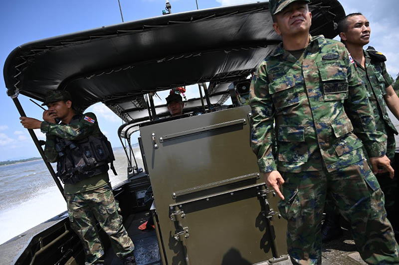 Thai navy and army officers on a May 23 boat patrol of the Mekong river between Thailand and Laos in the northeastern province of Nakhon Phanom province. Photo: Aidan Jones / AFP