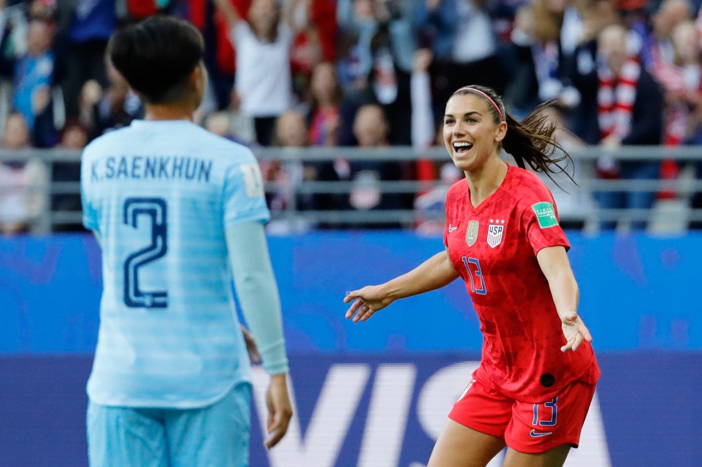United States’ forward Alex Morgan, at right, celebrates Tuesday after scoring a goal during the France 2019 Women’s World Cup Group F football match between USA and Thailand at the Auguste-Delaune Stadium in Reims, France. Photo: Thomas Samson / AFP