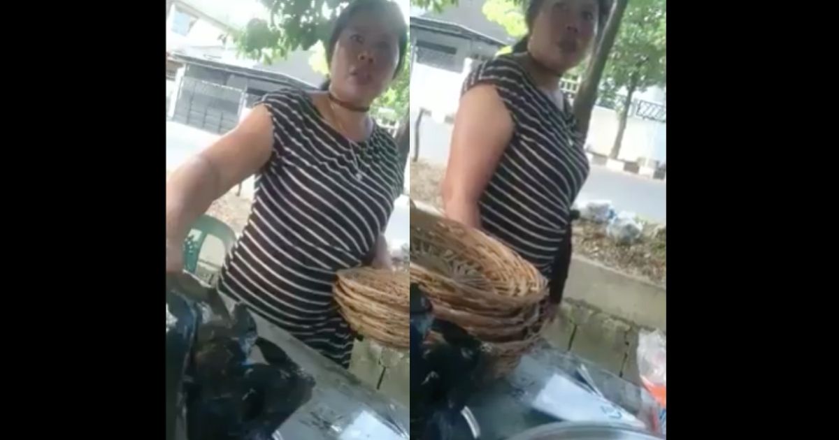 Milla, a rujak cingur (Javanese cow muzzle salad) seller in Surabaya, in the viral video. Screenshot from Facebook/Yang Lagi Viral