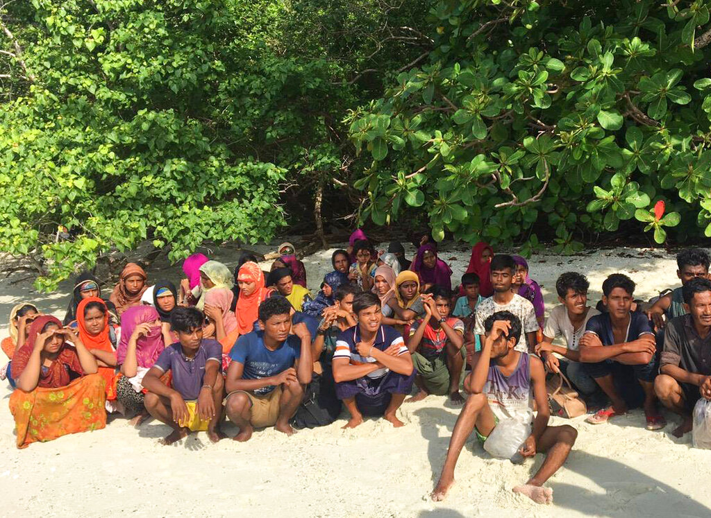 Rohingya sit Tuesday on abandoned island off the coast from Saturn province Photo: National Parks Wildlife and Plant Conservation Department