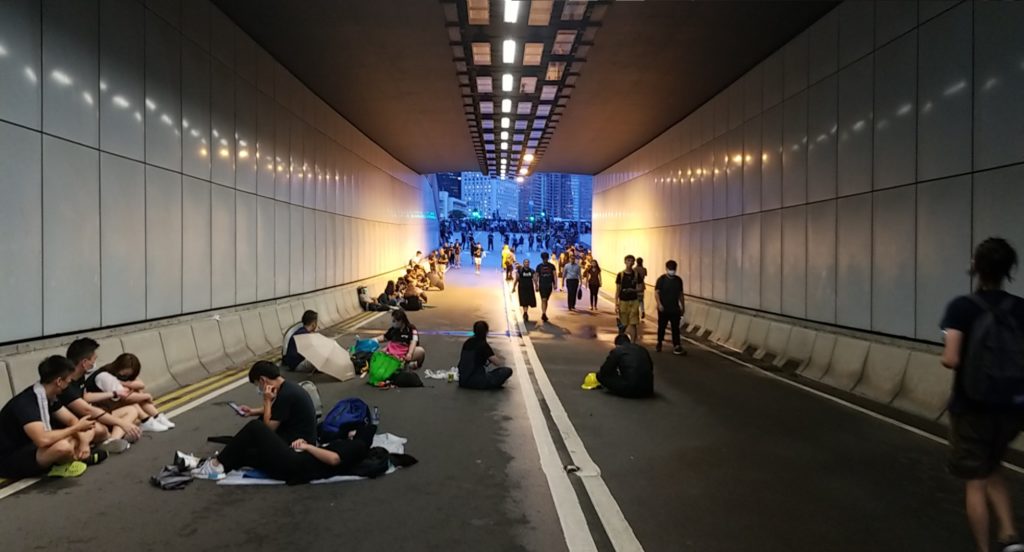 Protesters occupying a road behind the LegCo complex in Admiralty this evening. Photo by Vicky Wong.
