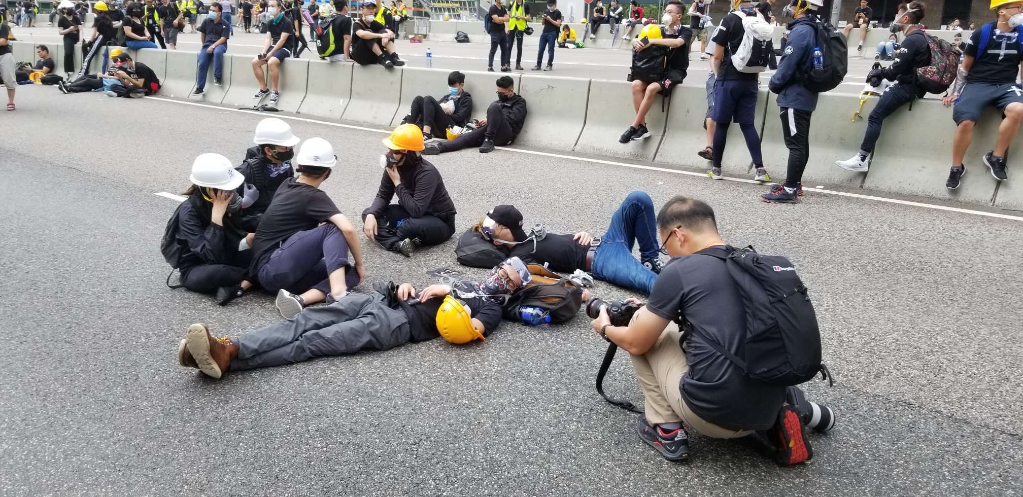 Protesters who remained on Harcourt Road overnight rest this morning. Photo by Vicky Wong.