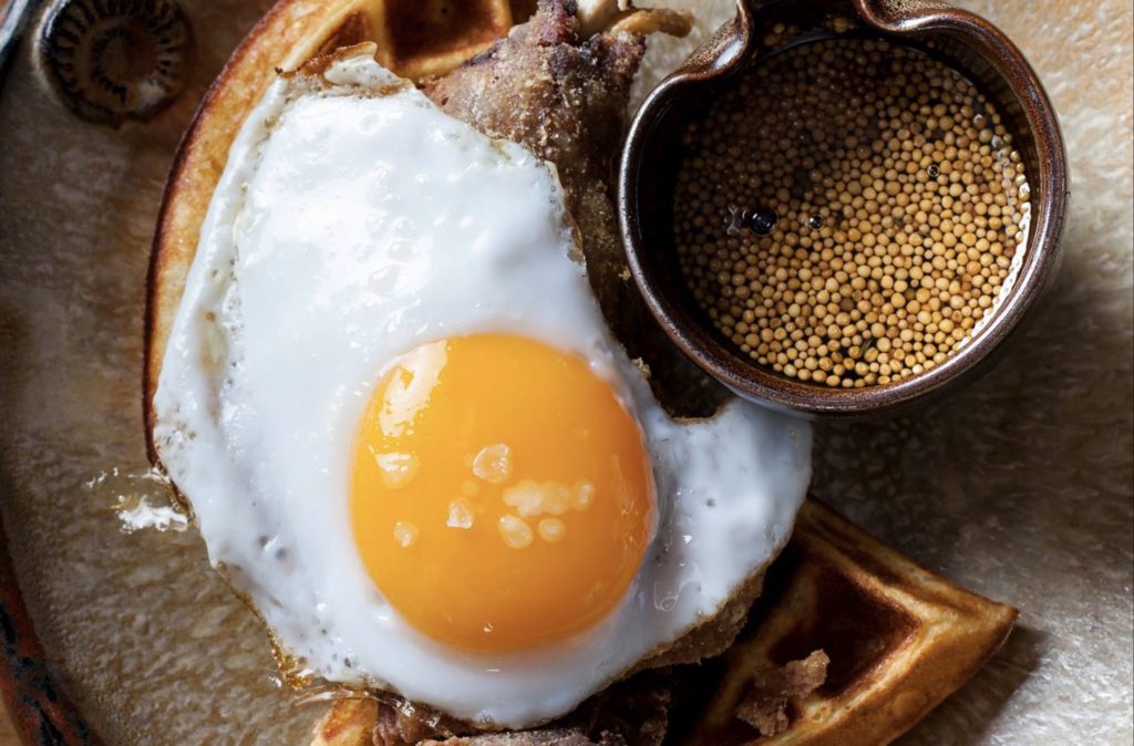 Duck and Waffle's signature dish, a fried duck and duck egg on a waffle. The London restaurant will be opening its first international outpost in Hong Kong this fall. Photo via Facebook/Duck and Waffle.
