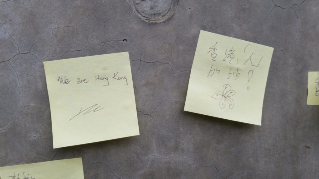 A pair of notes are seen stuck to the side of the Lennon Wall on June 12. The one on the right reads 'HK Add Oil!' a traditional rallying cry of encouragement among Hongkongers. Photo by Vicky Wong