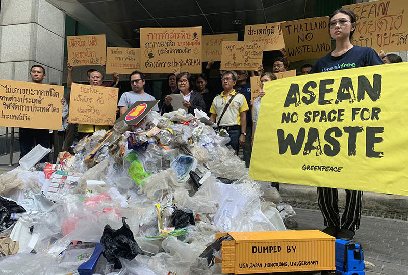 Protesters rally to demand a ban on importing trash into Southeast Asia on Thursday before the 34th ASEAN summit begins in Bangkok. Photo: Greenpeace Thailand