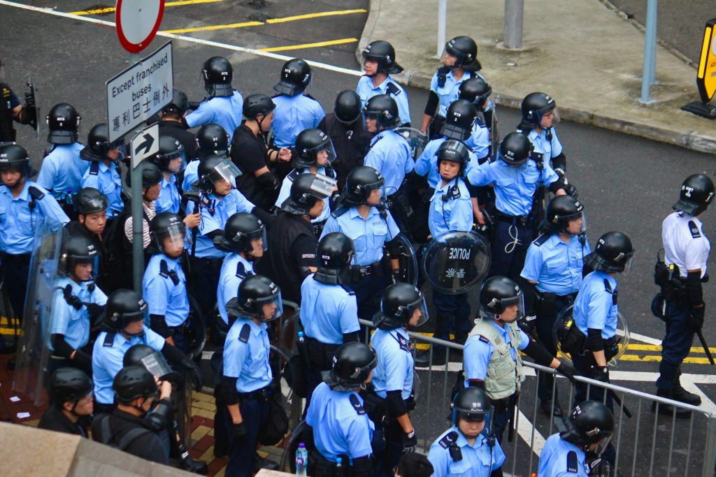 Police in riot gear during an extradition bill protest. Photo by Vicky Wong.