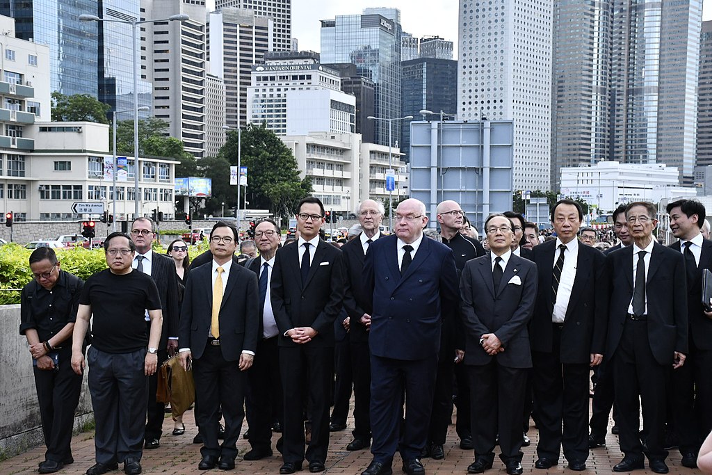 Lawmaker Dennis Kwok (fourth from left) and other members of the legal community stage a silent protest against a controversial extradition bill in Hong Kong earlier this month. Photo via VOA.