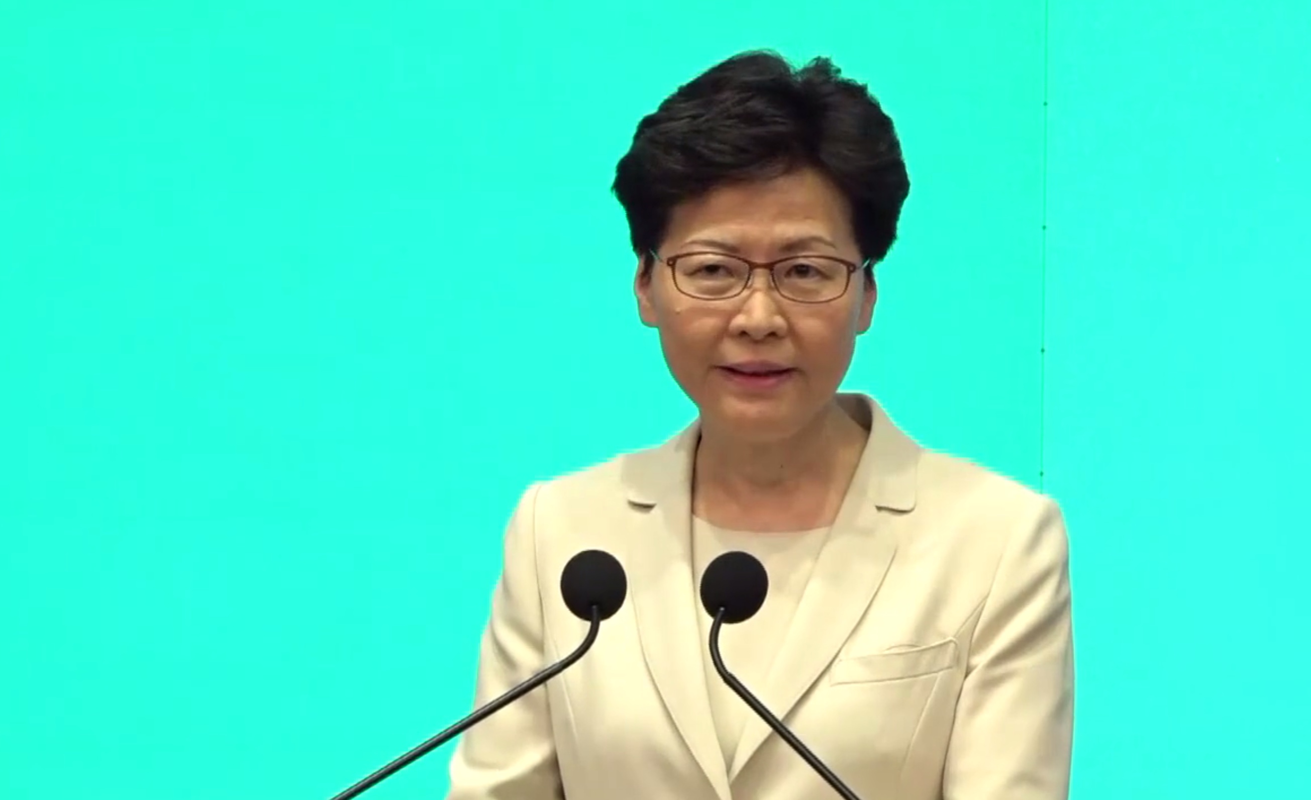 Hong Kong Chief Executive Carrie Lam speaks to the press this afternoon. Screengrab via Facebook.