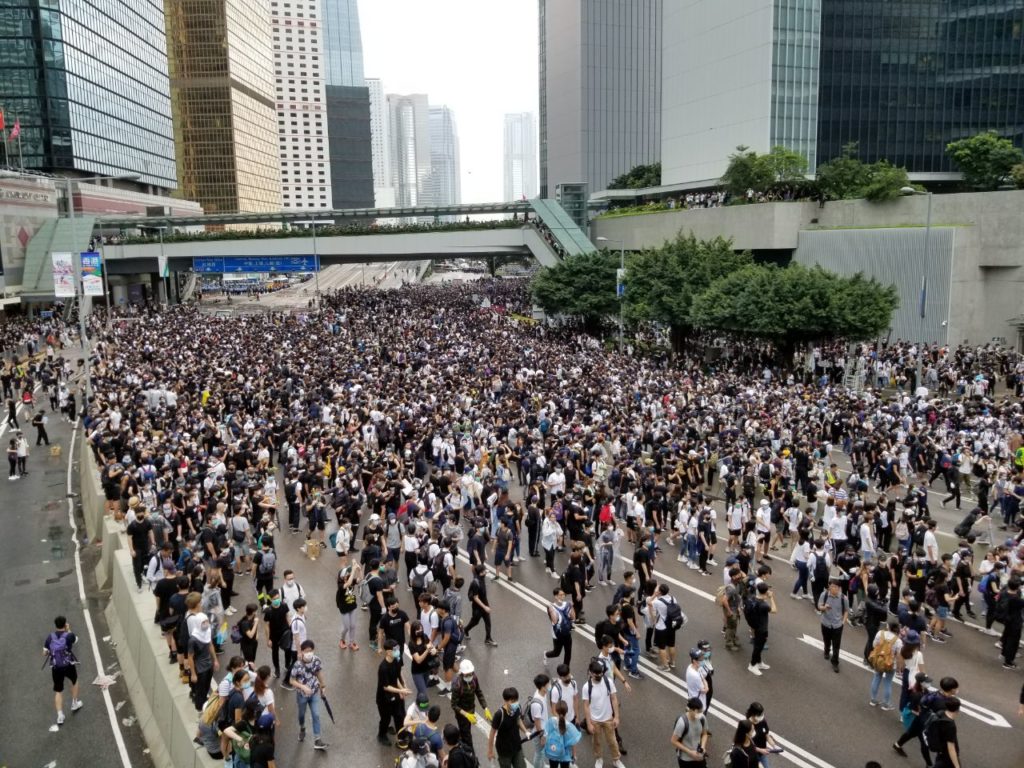 Protesters remove police barricades and move to block streets surrounding Hong Kong's Legislative Council building in defiance of a controversial bill that would open the door for extradition to mainland China. Coconuts Hong Kong/Vicky Wong