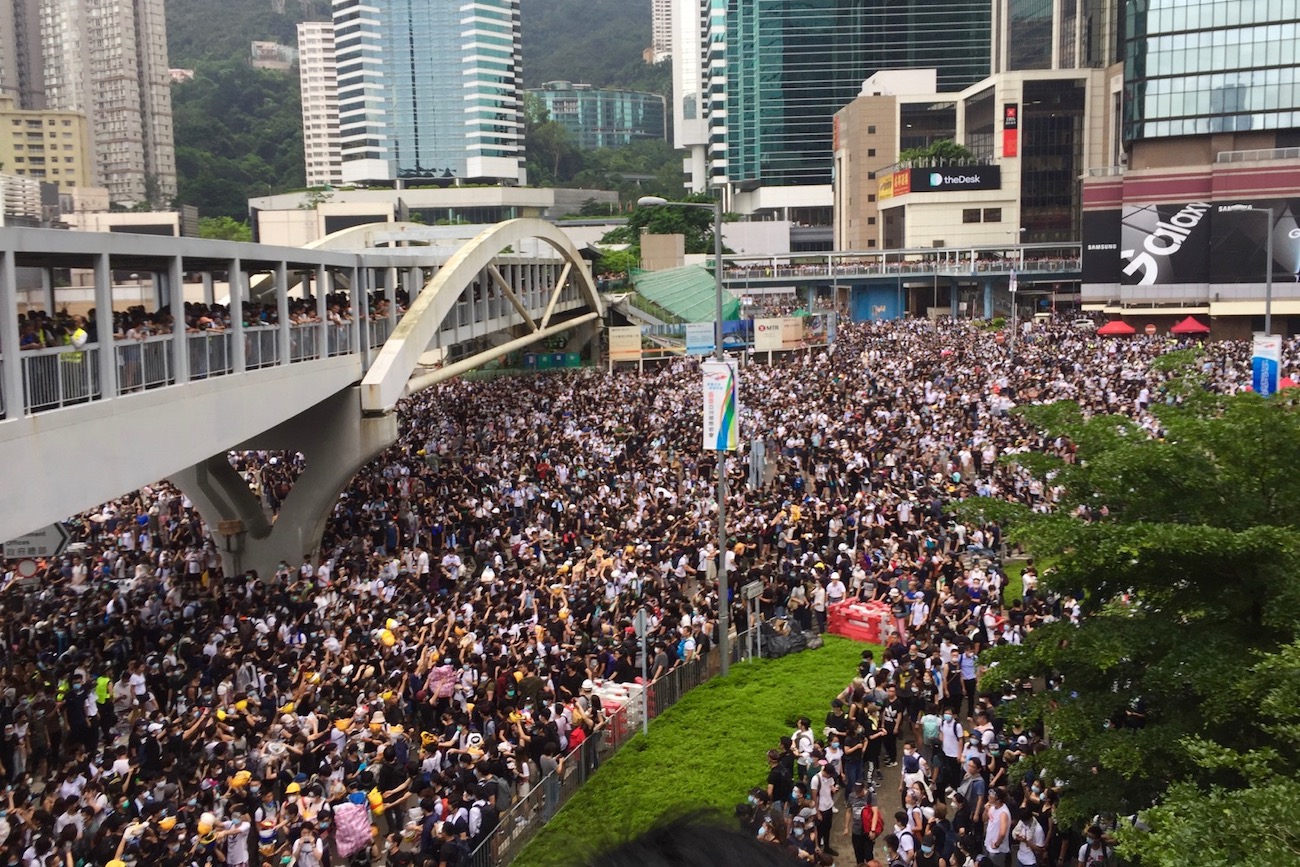 Thousands of protesters surround the LegCo complex in Hong Kong on June 12, 2019. Photo: Stuart White for Coconuts Media.