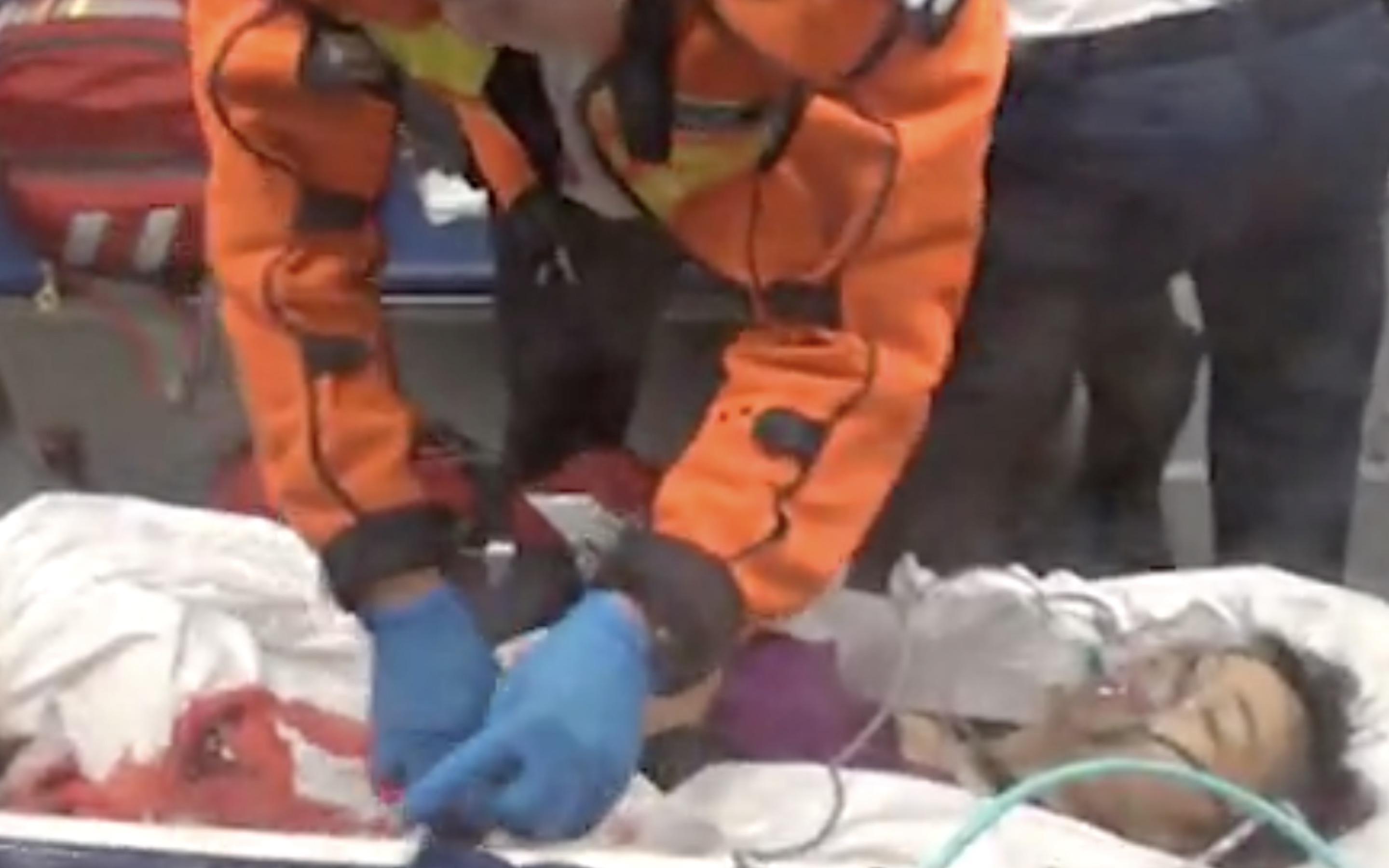 A 35-year-old woman is taken to hospital after she got stabbed five times in the abdomen by her ex-husband. Screengrab via Apple Daily video.